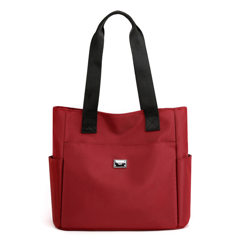 Sac à main polyvalent simple en nylon de couleur unie avec une grande capacité