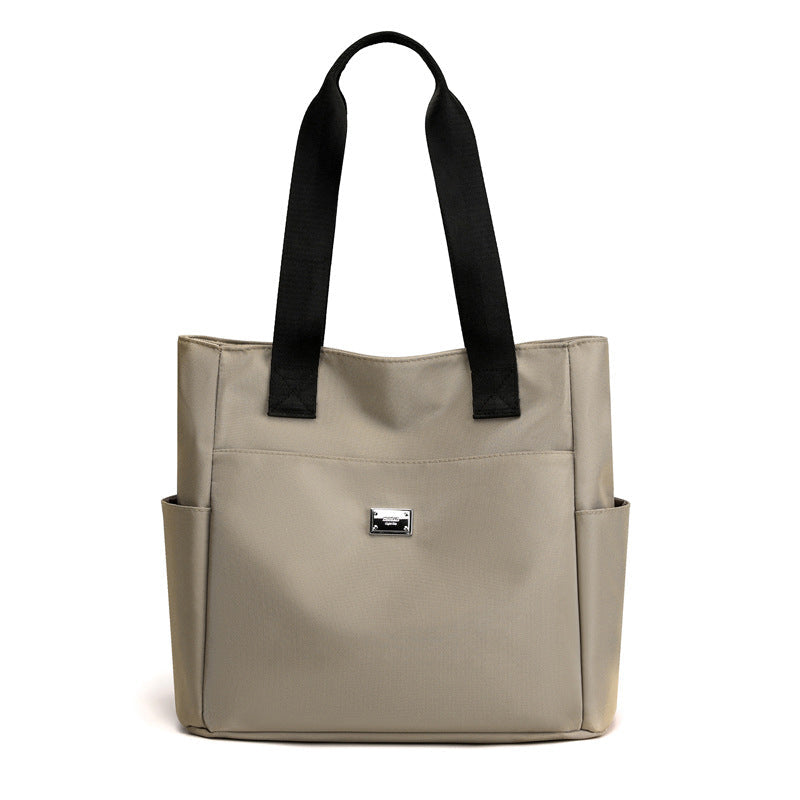 Sac à main polyvalent simple en nylon de couleur unie avec une grande capacité