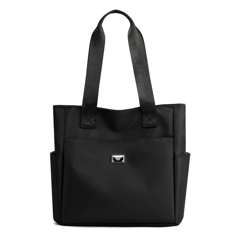 Sac à main polyvalent simple en nylon de couleur unie avec une grande capacité