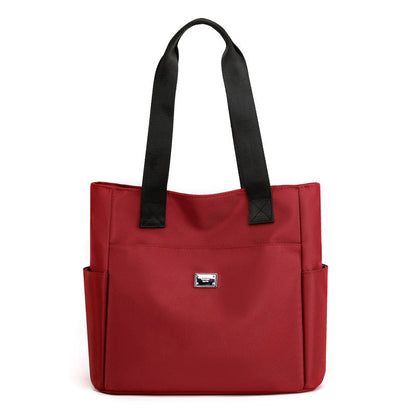 Sac à main polyvalent simple en nylon de couleur unie avec une grande capacité